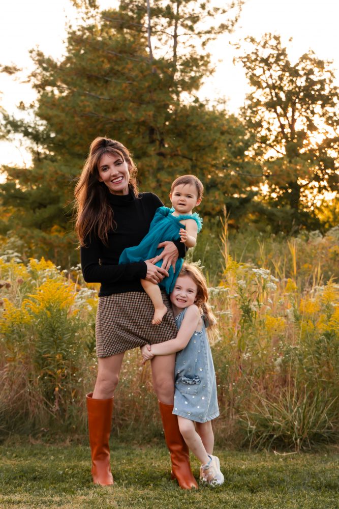 Sisters laughing with their mom in warm sunset light Cleveland Ohio family photography
