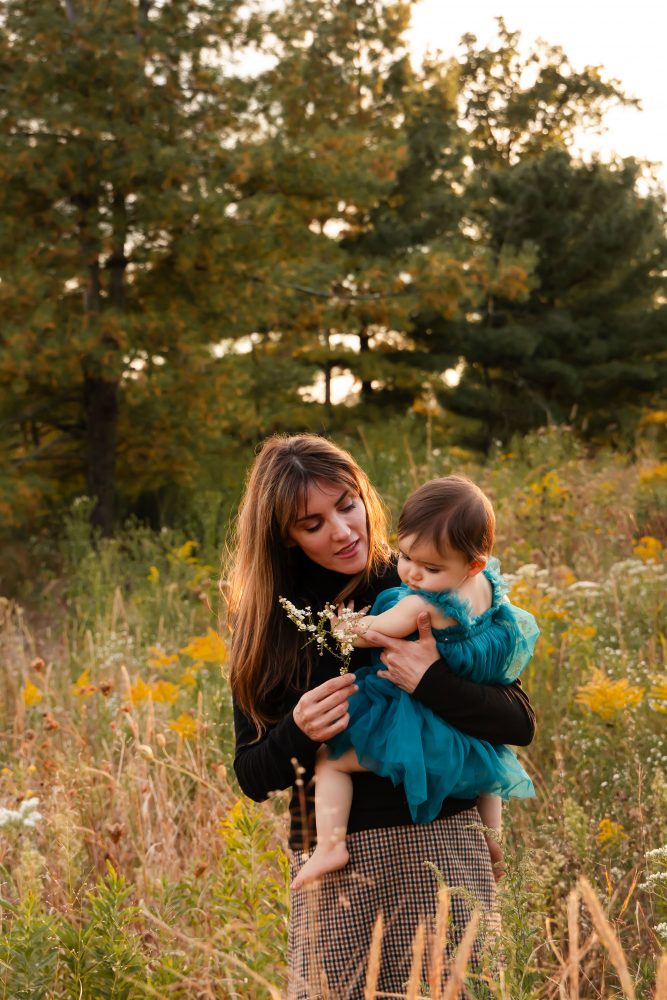 Sisters laughing with their mom in warm sunset light Cleveland Ohio family photography