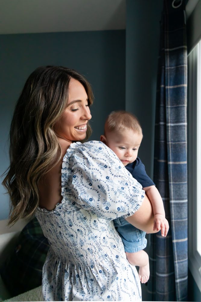 Lifestyle family portrait of parents with their newborn baby boy during in-home session in Cleveland Ohio.