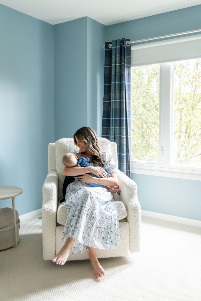 Lifestyle family portrait of parents with their newborn baby boy during in-home session in Cleveland Ohio.