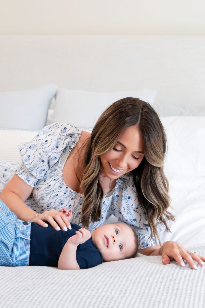 Lifestyle family portrait of parents with their newborn baby boy during in-home session in Cleveland Ohio.