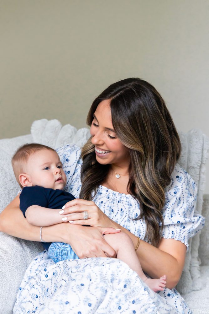 Lifestyle family portrait of parents with their newborn baby boy during in-home session in Cleveland Ohio.