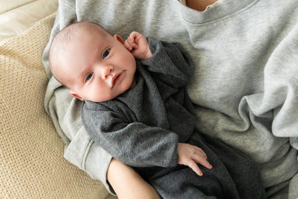 Natural light newborn photos of baby in neutral tones, simple and timeless Cleveland newborn session