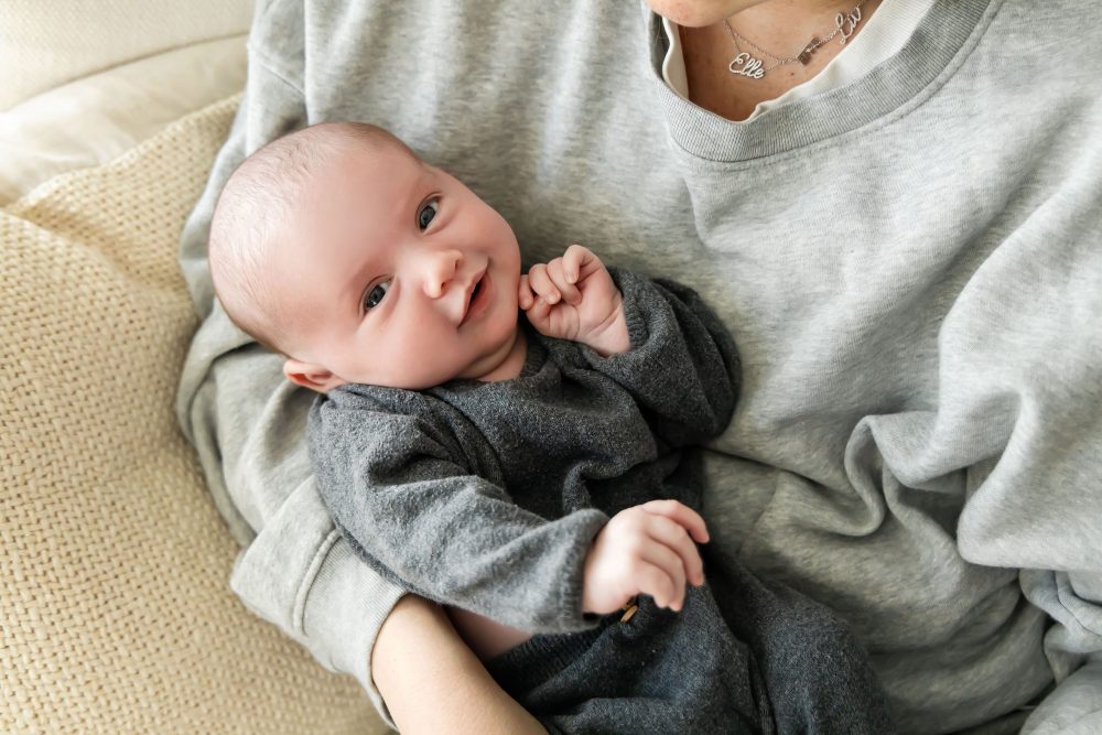 Cleveland newborn photography of baby in neutral outfit, natural light, simple baby-only session