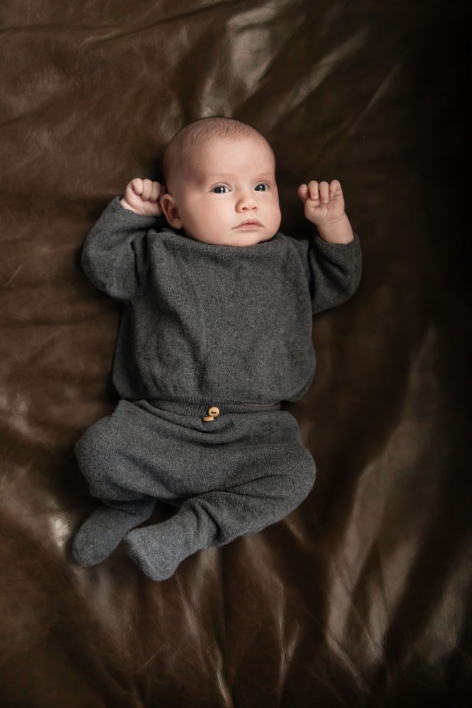 Cleveland newborn photography of baby in neutral outfit, natural light, simple baby-only session