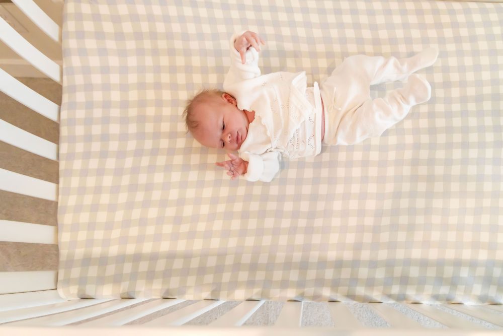 newborn baby girl at home in her crib in Cleveland Ohio