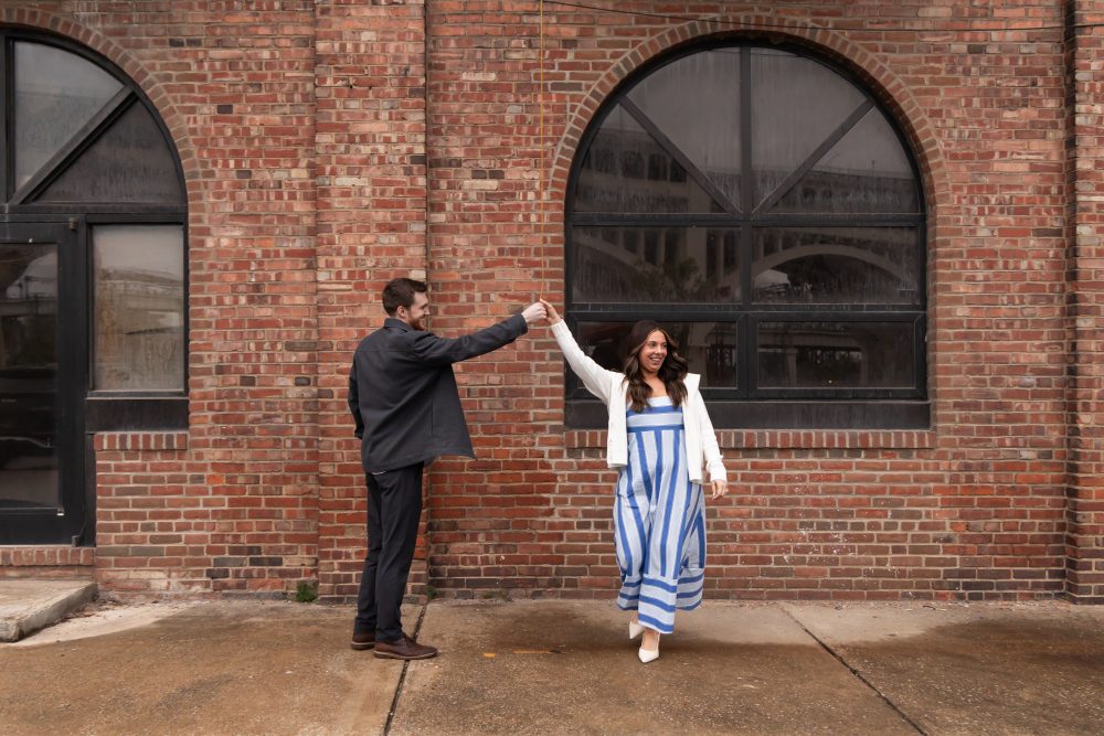 Newly engaged couple embracing after romantic proposal in downtown Cleveland, Ohio