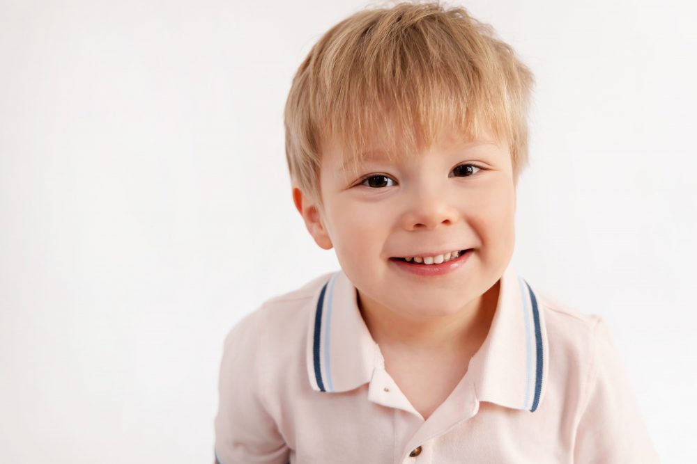 Smiling young boy studio portrait in Cleveland, Ohio by family photographer