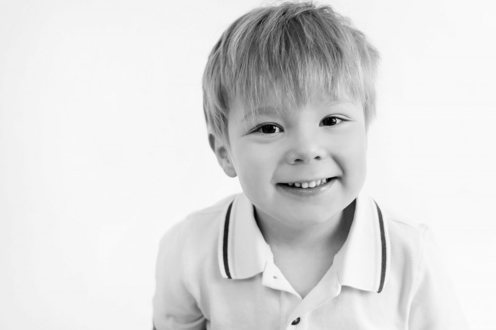Smiling young boy studio portrait in Cleveland, Ohio by family photographer