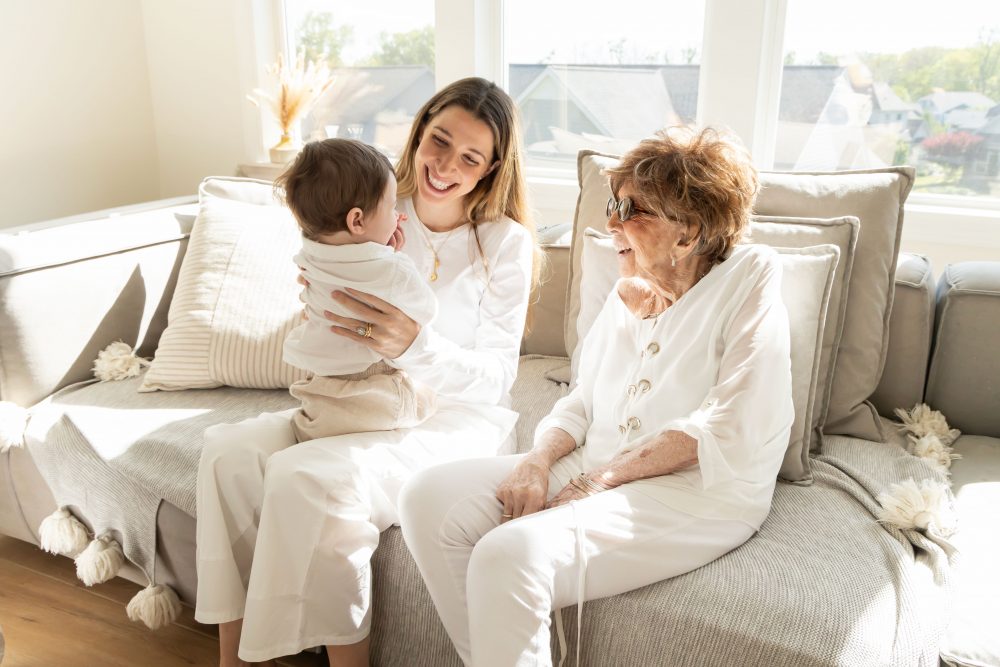 Multi-generational family photography session at home in Cleveland with grandparents, grandchildren, and the family dog