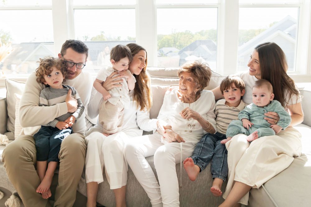 Multi-generational family photography session at home in Cleveland with grandparents, grandchildren, and the family dog
