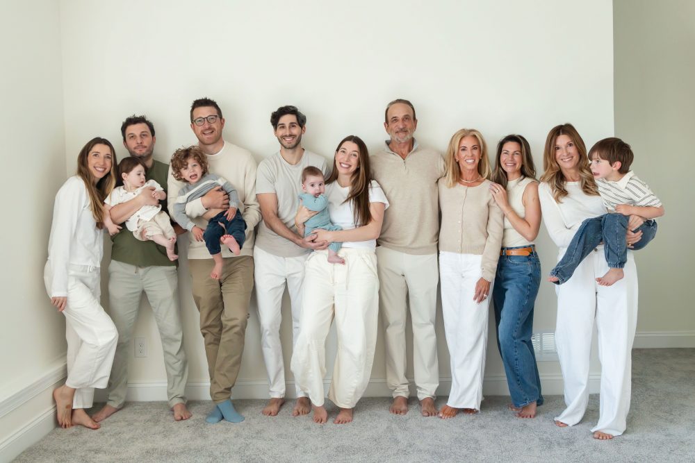 Multi-generational family photography session at home in Cleveland with grandparents, grandchildren, and the family dog