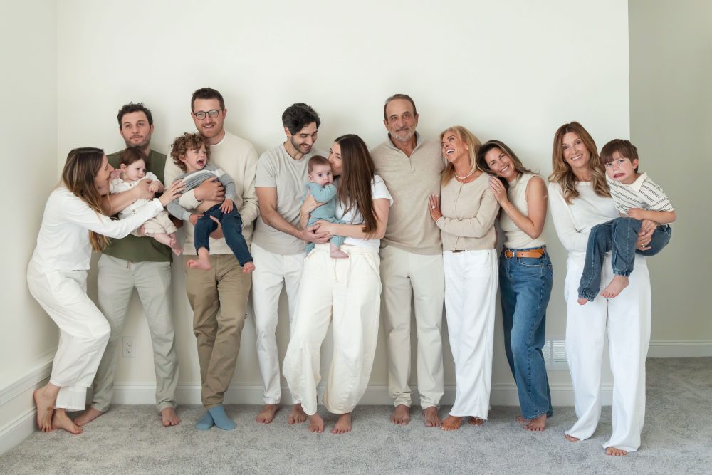 Multi-generational family photography session at home in Cleveland with grandparents, grandchildren, and the family 