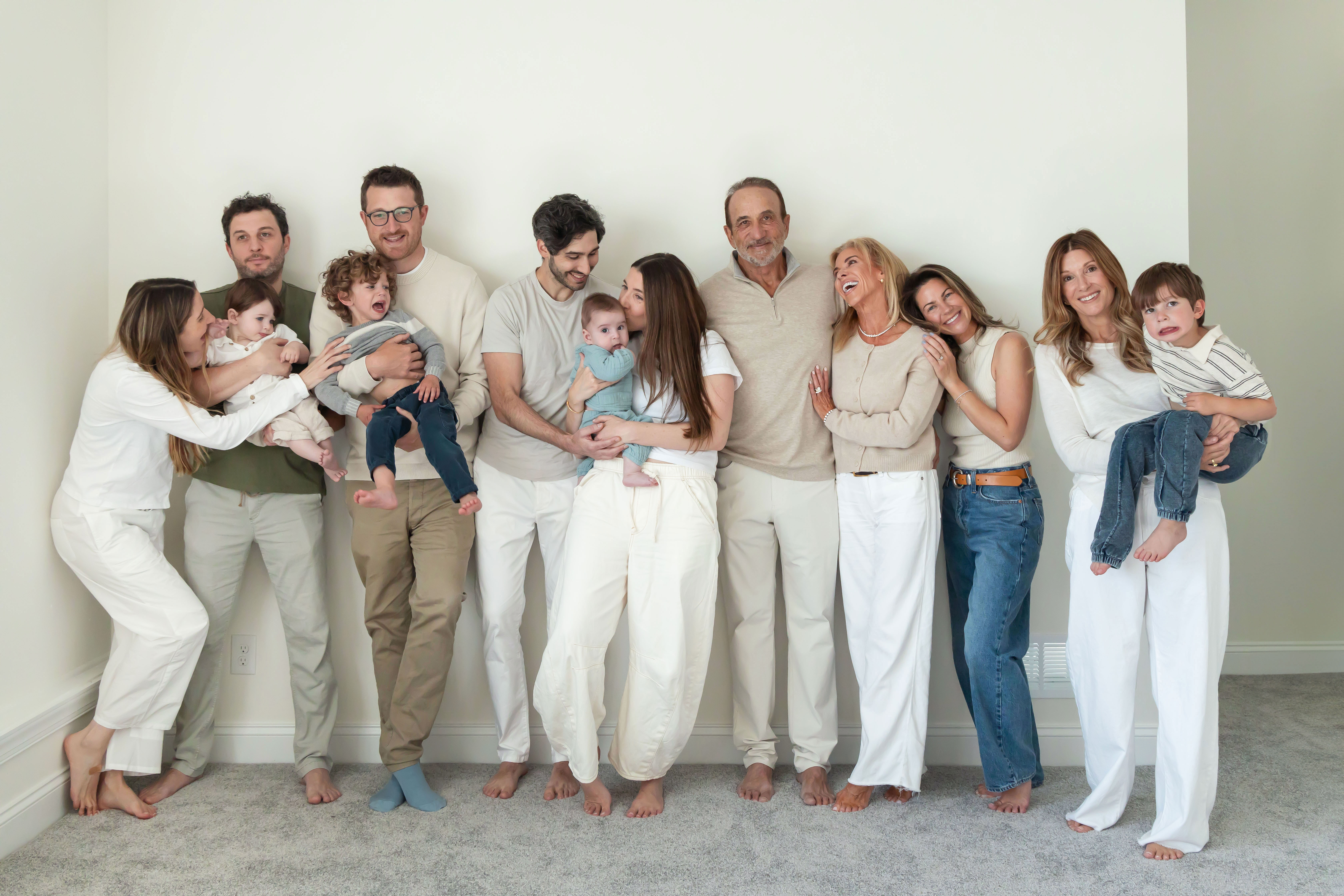 Multi-generational family photography session at home in Cleveland with grandparents, grandchildren, and the family