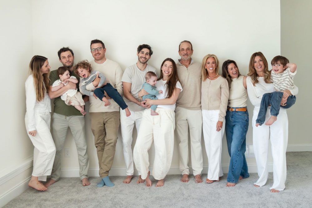 Three generations gathered for a relaxed family portrait outside their Cleveland home.