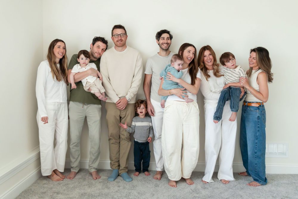 Three generations gathered for a relaxed family portrait outside their Cleveland home.