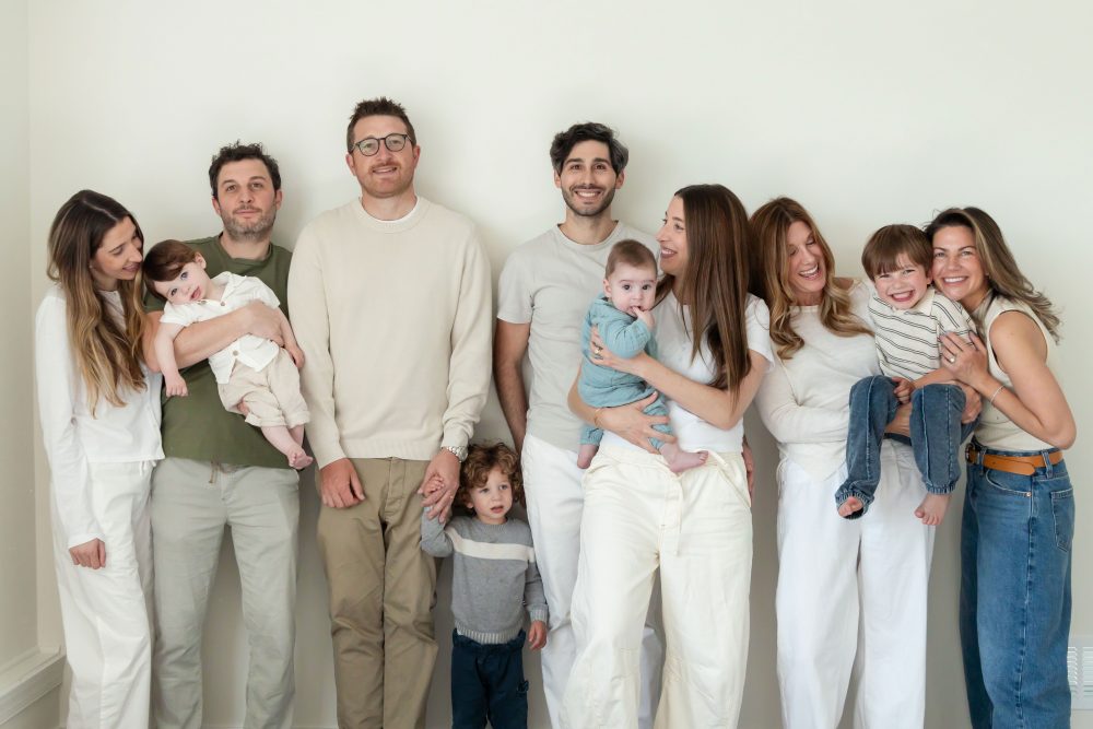 Three generations gathered for a relaxed family portrait outside their Cleveland home.
