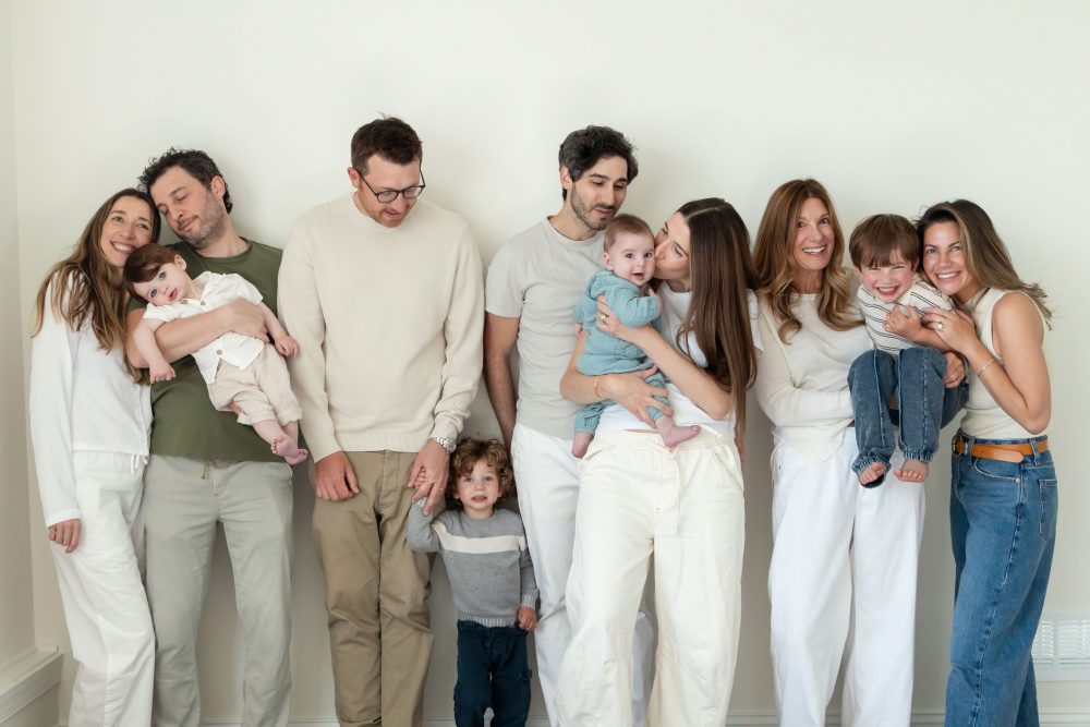 Three generations gathered for a relaxed family portrait outside their Cleveland home.