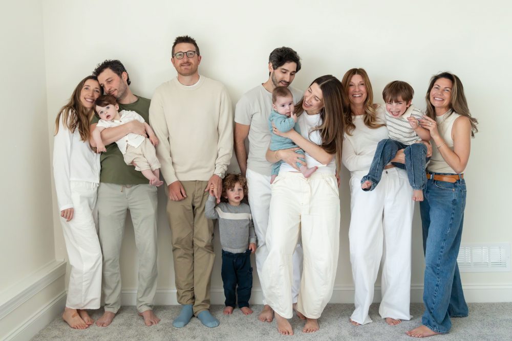 Three generations gathered for a relaxed family portrait outside their Cleveland home.