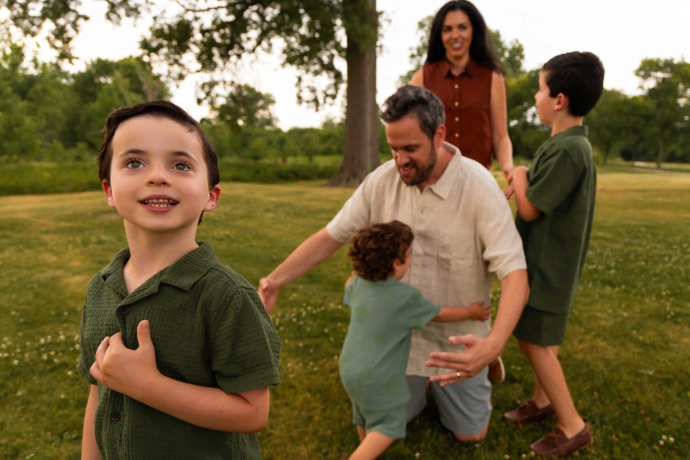 Family of five enjoying a summer sunset during a Cleveland family photography session
