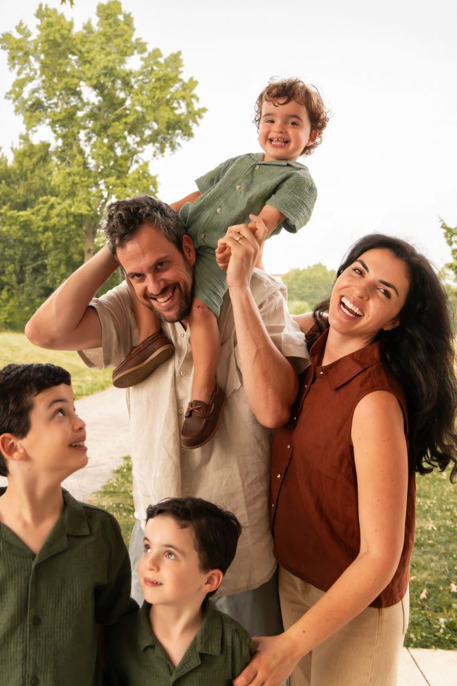 Cleveland family photographer capturing candid sibling moments outdoors