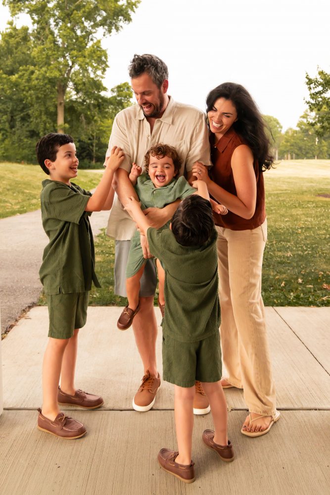 Cleveland family photographer capturing candid sibling moments outdoors
