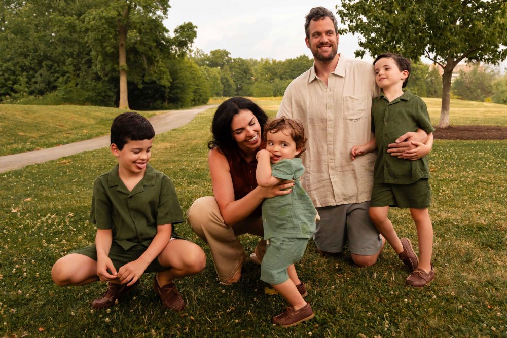 Cleveland family photographer photographing parents laughing and playing with their children