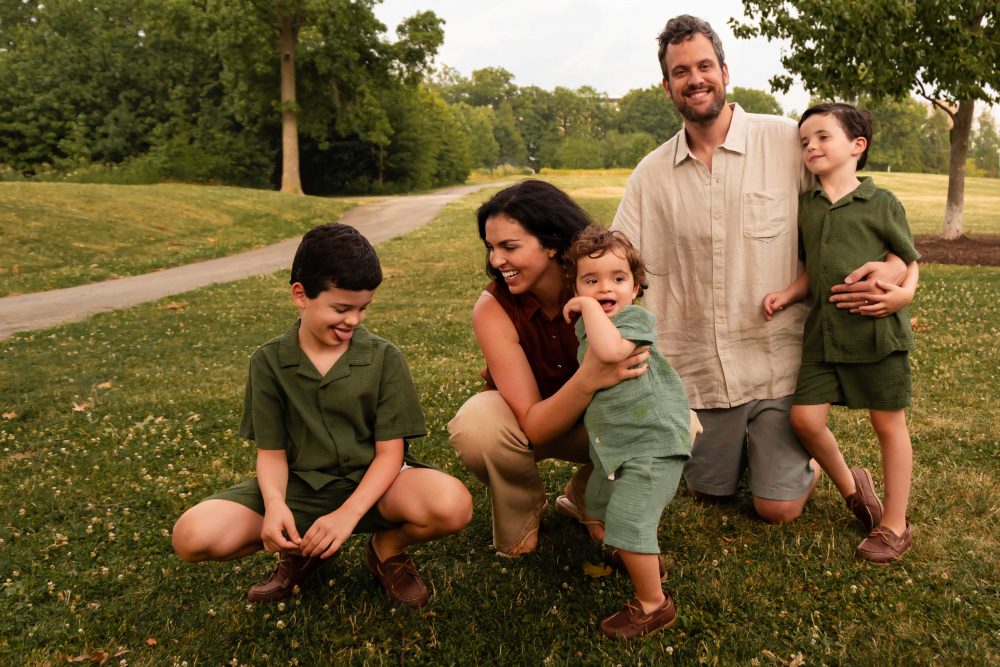 Cleveland family photographer photographing parents laughing and playing with their children