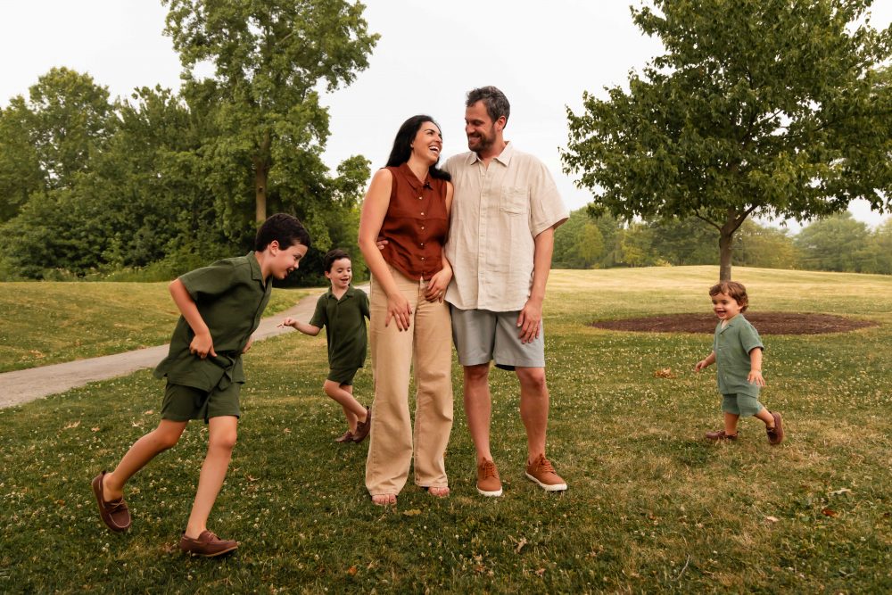 Outdoor family photography in Cleveland with three brothers playing together in the grass