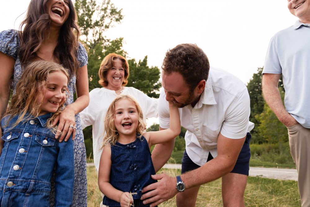 Extended family enjoying a warm sunset photography session in Cleveland Ohio