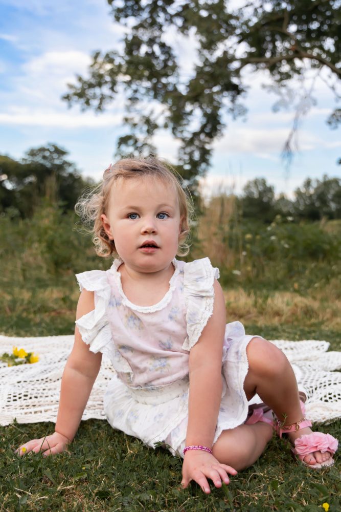 Sweet childhood portrait of a girl surrounded by wildflowers in Cleveland Ohio