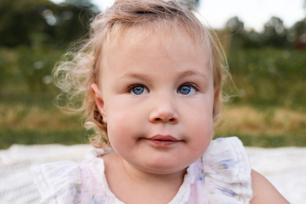 Sweet childhood portrait of a girl surrounded by wildflowers in Cleveland Ohio