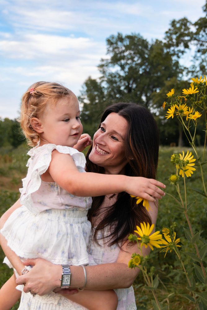 Cleveland Ohio family photography featuring a mother and daughter surrounded by yellow wildflowers