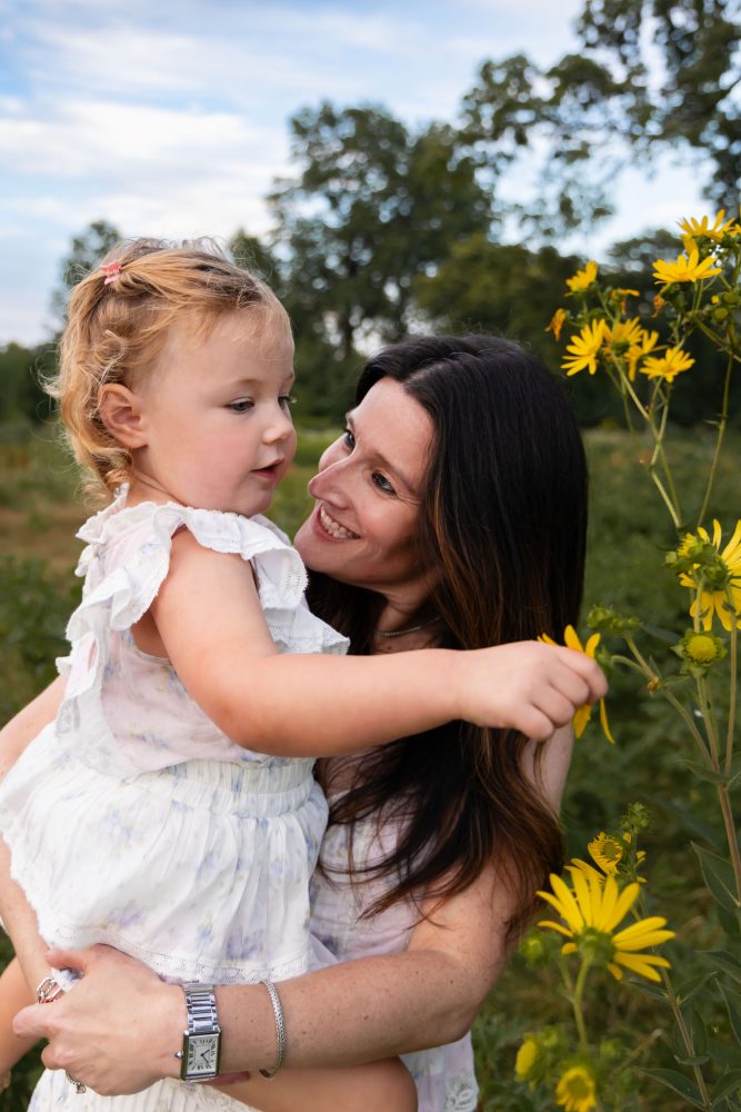 Cleveland Ohio family photography featuring a mother and daughter surrounded by yellow wildflowers