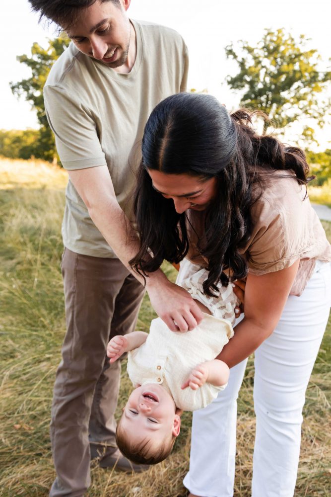 Mother and son play together during an outdoor sunset family photoshoot in Cleveland, Ohio