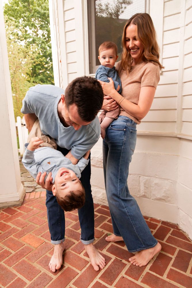 Cleveland, Ohio family photographer captures a playful portrait of a young family together at home.