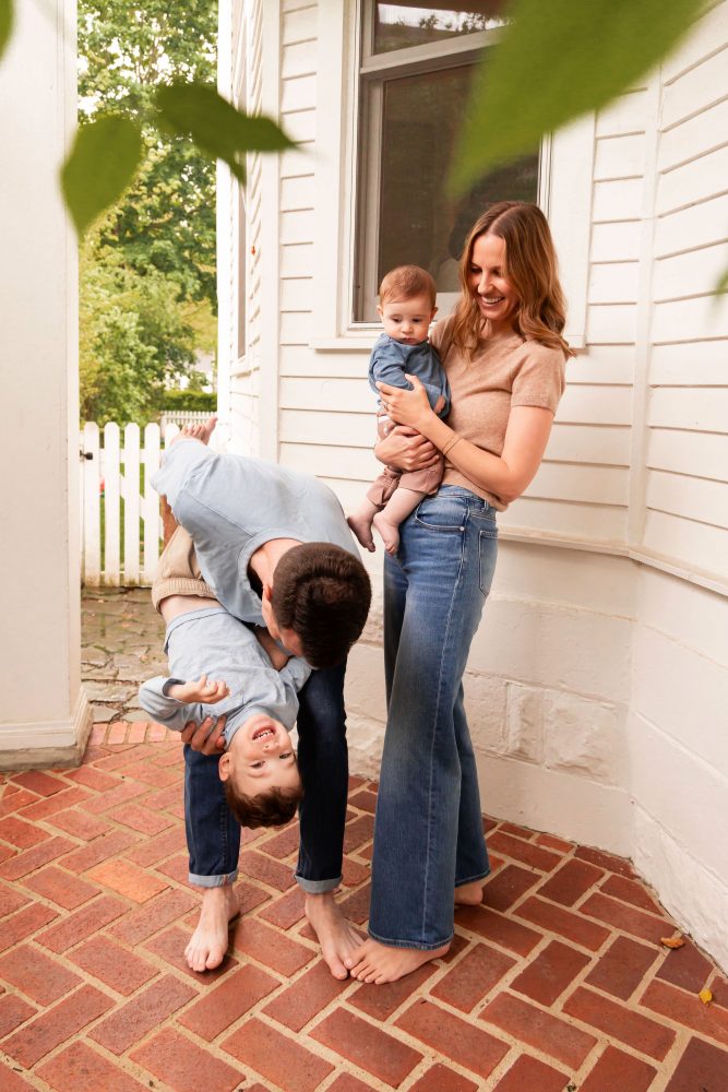 Cleveland, Ohio family photographer captures a playful portrait of a young family together at home.