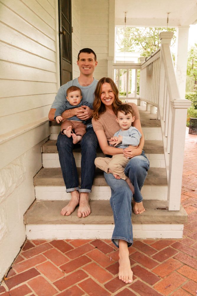 Cleveland family photographer Allison Liffman Photography captures a family of four together on their front porch.