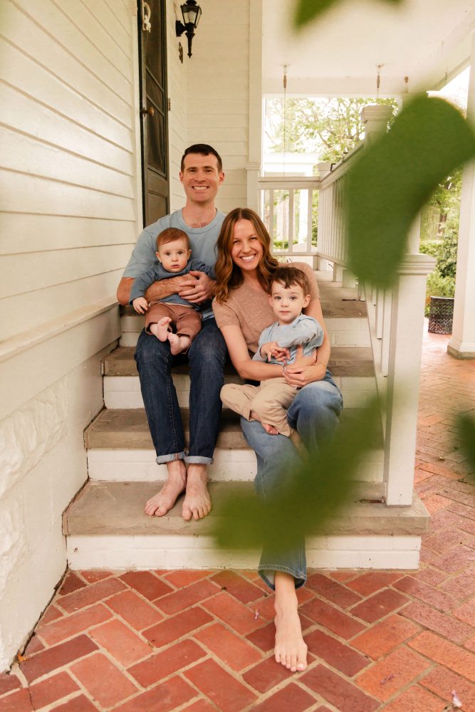 Cleveland family photographer Allison Liffman Photography captures a family of four together on their front porch.