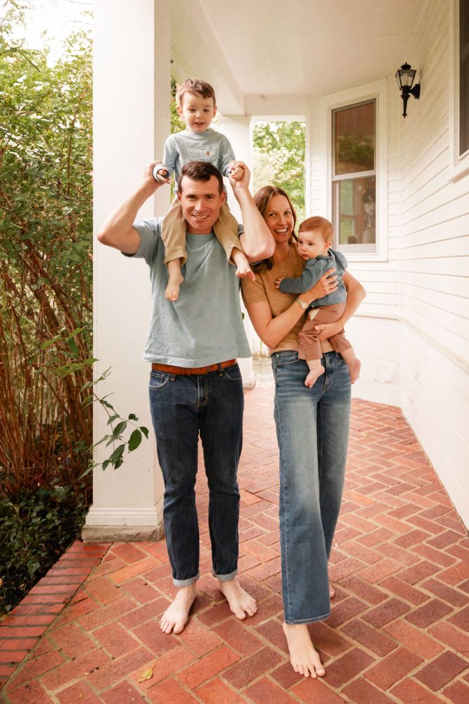 Candid family photography of parents playing with their two young sons at home in Cleveland, Ohio.