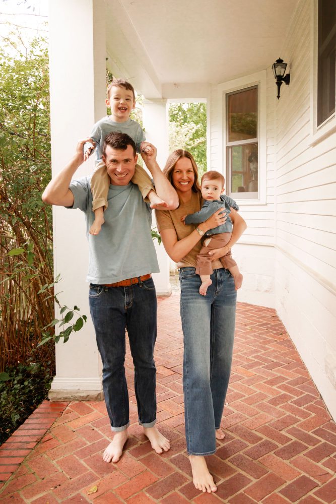 Candid family photography of parents playing with their two young sons at home in Cleveland, Ohio.
