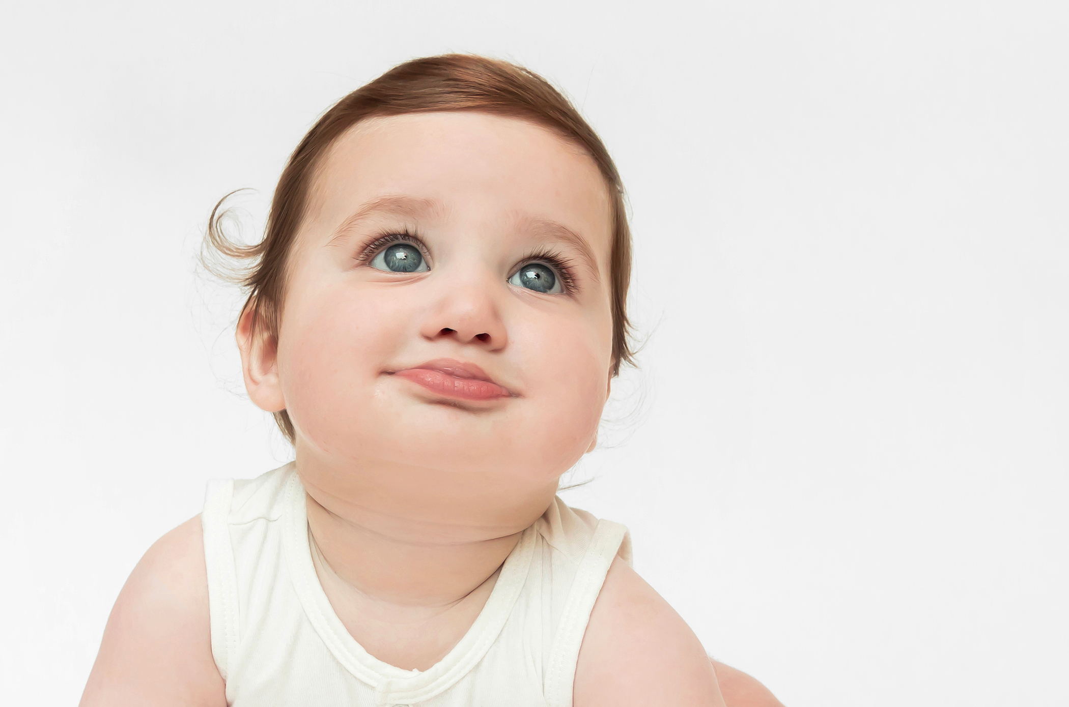 Portrait of a baby boy on the ground during a studio photoshoot with Cleveland, Ohio photographer Allison Liffman